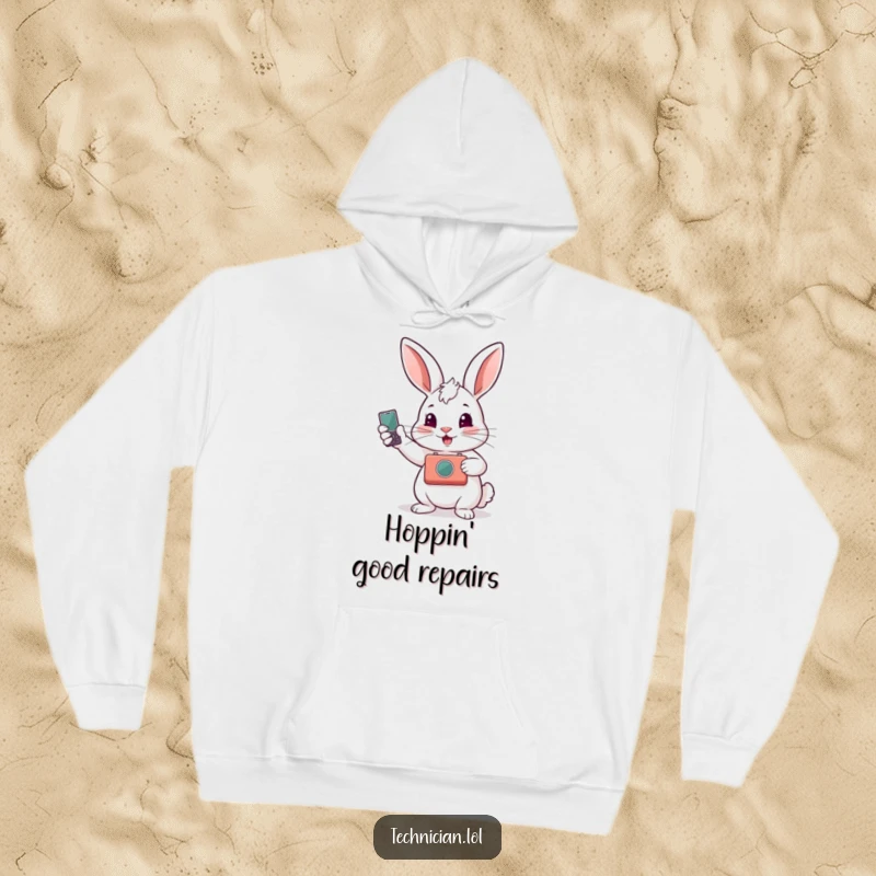 Funny hoodie depicting a proud rabbit showing off a fixed gadget, embodying skill and the satisfaction of a job well done.