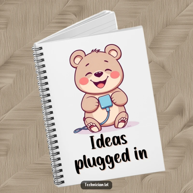Funny giggling bear character plugging in a cable, on the cover of a notebook, great for notes.